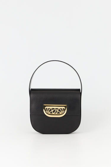 Black leather bag with golden latch