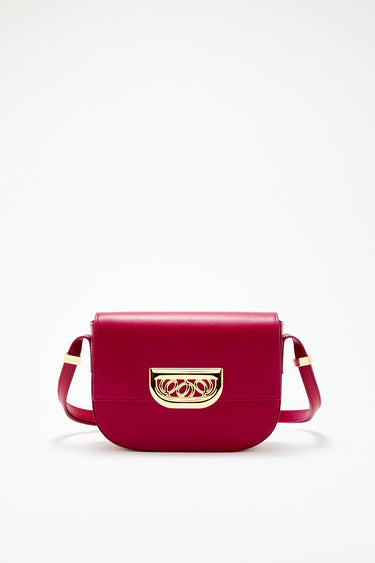 Red leather crossbody bag with golden clasp