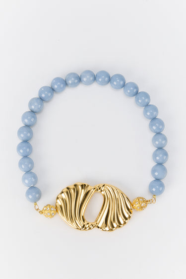 Blue beaded choker with gold centerpiece
