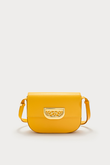 Yellow leather crossbody bag with golden clasp